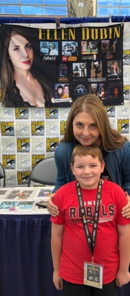 Ellen posing with young fan at San Diego Comic Con 2019
